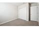 Simple bedroom with grey carpet and a double door closet at 1705 Forest Run Ln, Auburndale, FL 33823