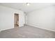 Bright bedroom with grey carpet and bathroom access at 1705 Forest Run Ln, Auburndale, FL 33823