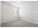 Spacious bedroom with grey carpet and window with blinds at 1705 Forest Run Ln, Auburndale, FL 33823