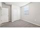 Bright bedroom with double door closet and carpeted floor at 1705 Forest Run Ln, Auburndale, FL 33823