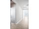 Bright hallway with tile flooring and access to bedrooms and bath at 1705 Forest Run Ln, Auburndale, FL 33823