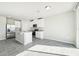 Modern kitchen with white cabinets, granite countertops and island at 1705 Forest Run Ln, Auburndale, FL 33823
