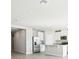 Open concept kitchen with stainless steel appliances and an island at 1705 Forest Run Ln, Auburndale, FL 33823