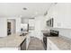 Modern kitchen with stainless steel appliances and granite countertops at 1705 Forest Run Ln, Auburndale, FL 33823