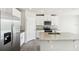 Modern kitchen with stainless steel appliances and granite countertops at 1705 Forest Run Ln, Auburndale, FL 33823
