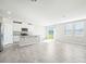 Modern kitchen featuring white cabinets and stainless steel appliances at 1705 Forest Run Ln, Auburndale, FL 33823