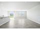 Spacious living area with tile floors and access to the backyard at 1705 Forest Run Ln, Auburndale, FL 33823