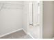 Spacious walk-in closet with wire shelving and carpeting at 1705 Forest Run Ln, Auburndale, FL 33823