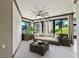 Bright sunroom with tiled floor and plenty of natural light at 2855 Gopherwood Way, Clermont, FL 34711