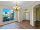 Elegant dining room with hardwood floors and a large window at 2855 Gopherwood Way, Clermont, FL 34711