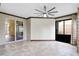Sunroom with access to the backyard and a view of the kitchen at 2855 Gopherwood Way, Clermont, FL 34711