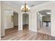 Bright dining room with hardwood floors and views into kitchen at 2855 Gopherwood Way, Clermont, FL 34711
