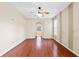 Spacious bedroom with hardwood floors and ceiling fan at 2855 Gopherwood Way, Clermont, FL 34711
