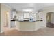 Modern kitchen featuring white cabinetry and granite counters at 2855 Gopherwood Way, Clermont, FL 34711