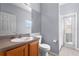 Bathroom with single sink and shower access at 2855 Gopherwood Way, Clermont, FL 34711