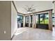 Sunroom featuring a ceiling fan and tiled floors at 2855 Gopherwood Way, Clermont, FL 34711