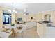Open concept dining area with a view into the living room and kitchen at 2855 Gopherwood Way, Clermont, FL 34711