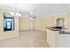 Open concept dining area with view into the living room and kitchen at 2855 Gopherwood Way, Clermont, FL 34711