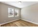 Bright bedroom with wood flooring and window blinds at 2137 Divot Dr, Daytona Beach, FL 32124