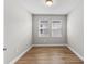 Simple bedroom with wood-look floors and neutral walls at 2149 Divot Dr, Daytona Beach, FL 32124