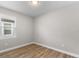 Bedroom with wood-look floors and neutral walls at 2149 Divot Dr, Daytona Beach, FL 32124