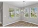 Breakfast nook with wood-look tile floors and large windows at 2149 Divot Dr, Daytona Beach, FL 32124