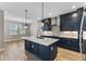 Open concept kitchen with large island and breakfast bar at 2149 Divot Dr, Daytona Beach, FL 32124