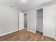 Bright bedroom with wood-look tile floors and a large closet at 2149 Divot Dr, Daytona Beach, FL 32124