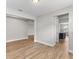 Open living room with wood-look tile floors and views to kitchen at 2149 Divot Dr, Daytona Beach, FL 32124