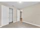 Well-lit bedroom with neutral walls and carpet flooring, along with a large closet at 3116 Legends Preserve Dr, Daytona Beach, FL 32124