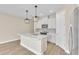 Modern kitchen with white cabinets, quartz countertops, and stainless steel appliances at 3116 Legends Preserve Dr, Daytona Beach, FL 32124