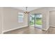 Dining area with hardwood floors and sliding glass doors leading to the patio at 3116 Legends Preserve Dr, Daytona Beach, FL 32124