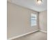 Spacious bedroom with neutral walls and carpet flooring, featuring a window with blinds at 3116 Legends Preserve Dr, Daytona Beach, FL 32124