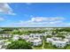 Aerial view of condo community with multiple buildings, landscaping, and parking. Shows surrounding landscape at 3937 Atrium Dr # 5, Orlando, FL 32822