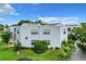 Exterior view of condo building with landscaping at 3937 Atrium Dr # 5, Orlando, FL 32822