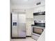 Stainless steel appliances and white cabinets in this kitchen at 3937 Atrium Dr # 5, Orlando, FL 32822