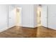 Bedroom with wood-look flooring and access to bathroom at 3937 Atrium Dr # 5, Orlando, FL 32822