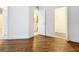Bedroom with wood-look flooring and access to bathroom at 3937 Atrium Dr # 5, Orlando, FL 32822