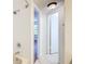 Clean hallway with tiled floor and access to bathroom and bedroom at 3937 Atrium Dr # 5, Orlando, FL 32822