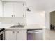 White cabinets, stainless steel appliances, and a dishwasher at 3937 Atrium Dr # 5, Orlando, FL 32822