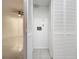 Laundry closet with built-in shelving and a stacked washer/dryer at 3937 Atrium Dr # 5, Orlando, FL 32822