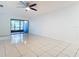 Living room with tile floors and sliding glass doors to a patio at 3937 Atrium Dr # 5, Orlando, FL 32822