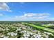 Aerial view of a community featuring residential buildings, landscaping, parking, and surrounding landscape at 3937 Atrium Dr # 5, Orlando, FL 32822