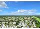Aerial view of a community, showing residential buildings, landscaping, parking, and a glimpse of the surrounding area at 3937 Atrium Dr # 5, Orlando, FL 32822