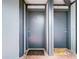 Two condo unit entry doors with welcome mats at 3937 Atrium Dr # 5, Orlando, FL 32822