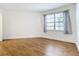Well-lit bedroom showcasing wood-look flooring at 3937 Atrium Dr # 5, Orlando, FL 32822