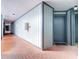 Interior hallway with brick floor and unit entrance at 3937 Atrium Dr # 5, Orlando, FL 32822