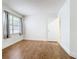 Bedroom with wood-look flooring and window at 3937 Atrium Dr # 5, Orlando, FL 32822