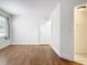 Bedroom with wood-look floors and large window at 3937 Atrium Dr # 5, Orlando, FL 32822