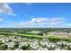 Aerial view of a residential community showing buildings, ample parking, and surrounding landscape at 3937 Atrium Dr # 5, Orlando, FL 32822